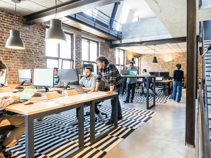 Employees working at desks in an office.