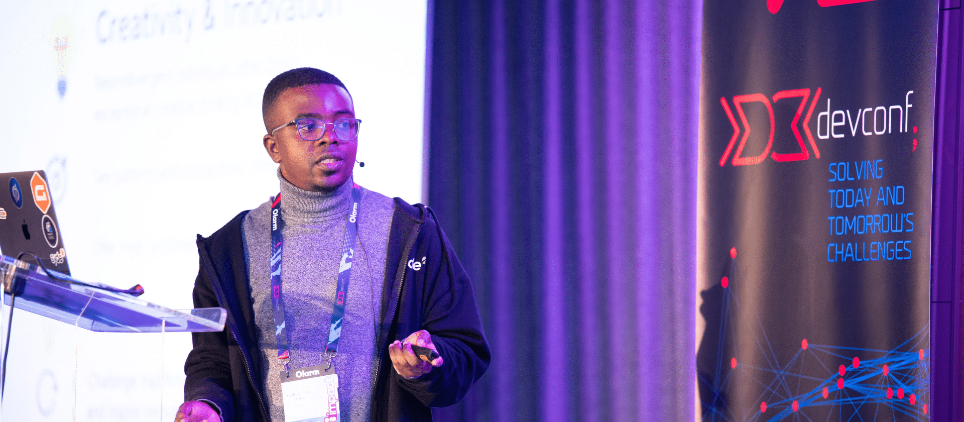 Femi speaking at DevConf ZA 2025