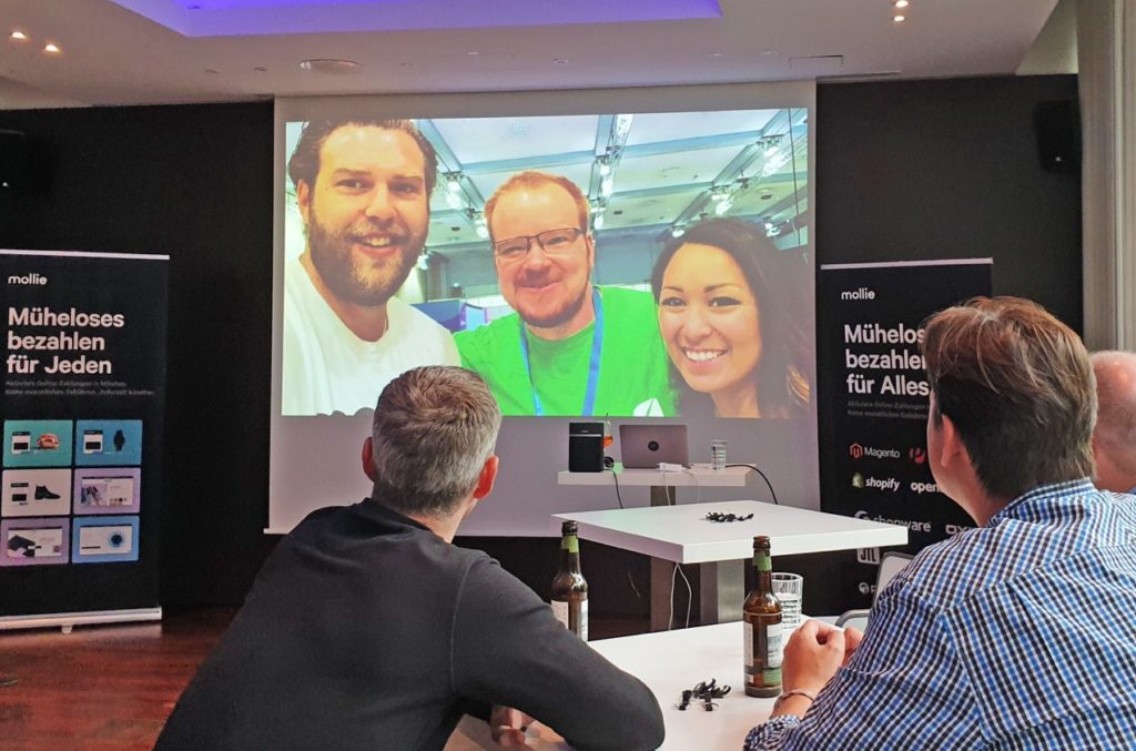 Picture of Morten Michelsen, Daniel Hüsken and Aleah Belluga at a talk at the Mollie Partner Day
