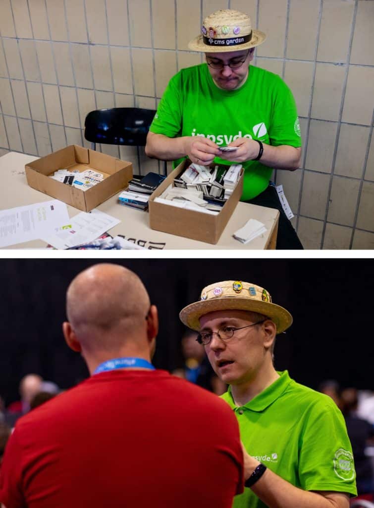 Robert in two photos: at a table at a WordCamp sorting stickers as presents and in a lively conversation with another man. On both photos, he wears his trademark, the straw hat with many patches.