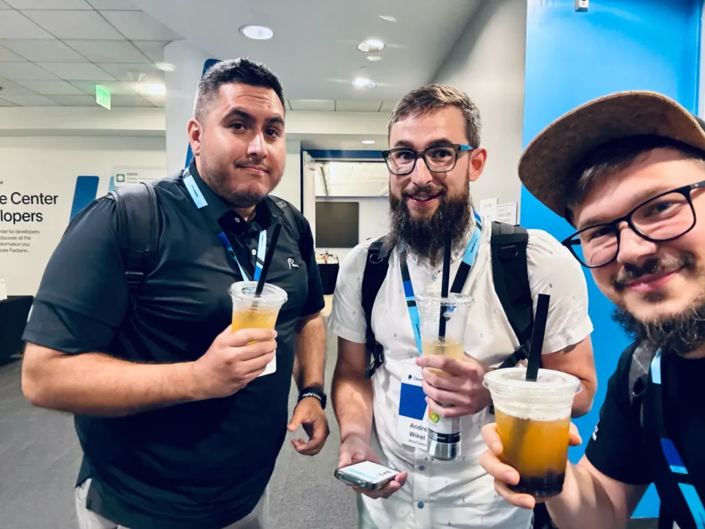 A selfie by Danny with Automatticians Andre Wilkel and John Coy, smiling and holding up their drinks