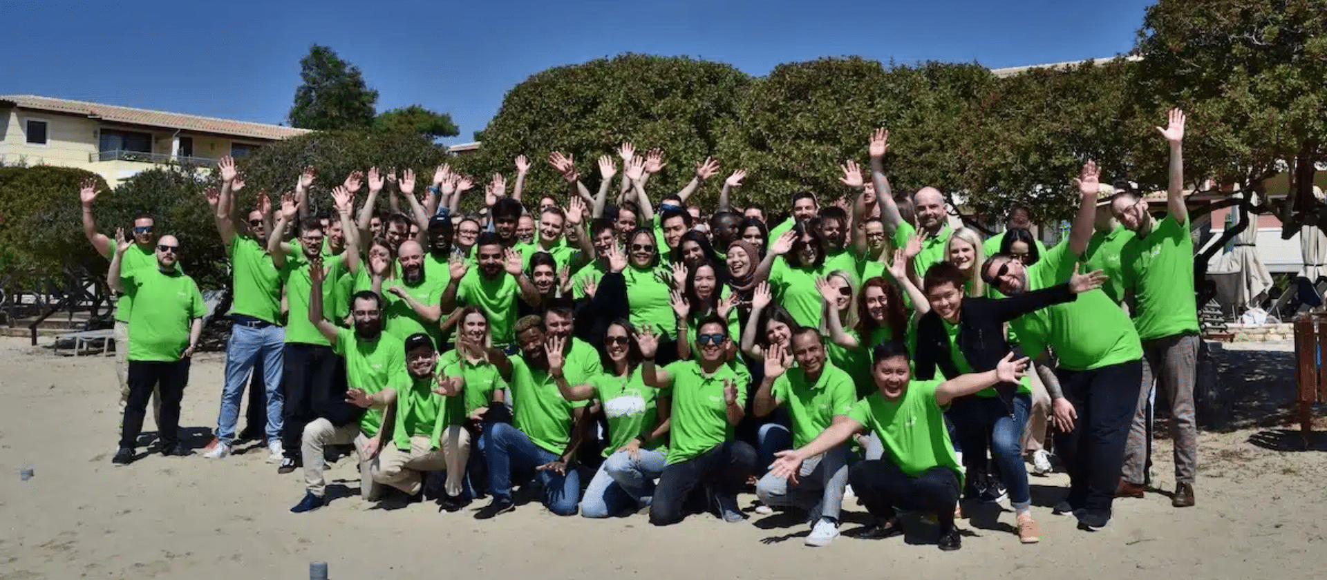 A group shot of all of the remote Syde employees on the beach in Greece.